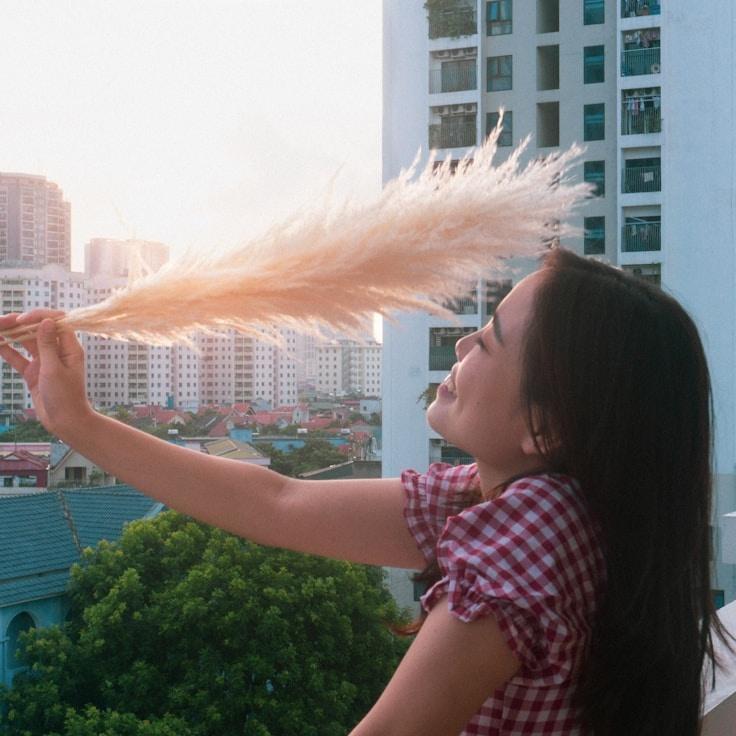 A. Singh, Lead Design Curator at Ripple Meadow Loft, reviewing corporate floral arrangements